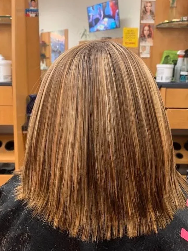 After: Smooth, straight bob with soft blonde highlights.