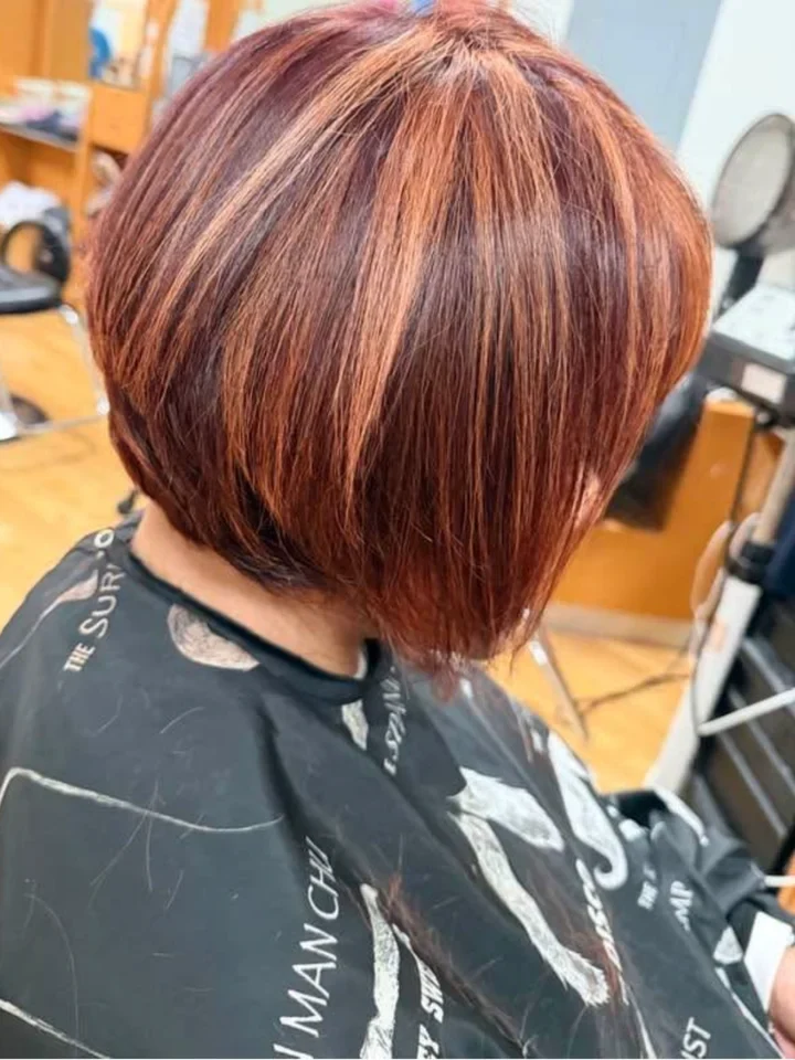After: Stacked bob with copper and auburn highlights.